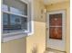 Inviting front entrance with a secure screen door and a bright window for natural light at 6610 Gasparilla Pines Blvd # 111, Englewood, FL 34224
