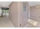 Hallway with access to living room and tiled flooring at 6610 Gasparilla Pines Blvd # 111, Englewood, FL 34224