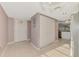 Hallway featuring closet storage and tiled flooring at 6610 Gasparilla Pines Blvd # 111, Englewood, FL 34224
