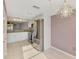 Eat in kitchen with granite counters, stainless appliances, and tile floors at 6610 Gasparilla Pines Blvd # 111, Englewood, FL 34224