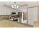 Bright kitchen has granite countertops, stainless steel appliances, white cabinets and flows to dining at 6610 Gasparilla Pines Blvd # 111, Englewood, FL 34224