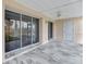 Open patio with tile floor and access to outdoor living space at 6610 Gasparilla Pines Blvd # 111, Englewood, FL 34224