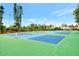 Exterior shot of tennis courts featuring modern design and pristine conditions at 6610 Gasparilla Pines Blvd # 111, Englewood, FL 34224