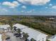 Aerial view of building complex with parking and view of Florida landscape and marshland in the background at 6800 Placida Rd # 133, Englewood, FL 34224