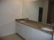 Bathroom with granite countertops and double sinks at 6998 Dabarsky Ave, North Port, FL 34291