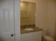 Bathroom with a granite countertop vanity and toilet at 6998 Dabarsky Ave, North Port, FL 34291