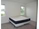 Bright bedroom with two windows and neutral carpet at 6998 Dabarsky Ave, North Port, FL 34291