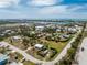 Overhead view of neighborhood and blue ocean water, homes, and streets from above at 7032 Duke St, Englewood, FL 34224