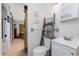 A bathroom with a barn door leading to the bedroom at 7032 Duke St, Englewood, FL 34224