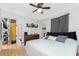 The primary bedroom features soft textures and bright natural light at 7032 Duke St, Englewood, FL 34224