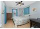 Cozy bedroom featuring an air conditioner and ceiling fan at 7032 Duke St, Englewood, FL 34224