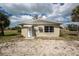 Street view of home with driveway and mature landscaping at 7032 Duke St, Englewood, FL 34224