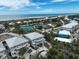 Coastal community featuring beachfront homes, tennis courts, lush greenery, and a scenic ocean view at 7237 Rum Bay Dr # 5022, Placida, FL 33946
