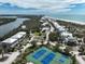 Coastal aerial of a community with waterfront homes and pristine beach at 7237 Rum Bay Dr # 5022, Placida, FL 33946