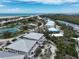 Coastal community featuring beachfront homes, tennis courts, lush greenery, and a scenic ocean view at 7237 Rum Bay Dr # 5022, Placida, FL 33946