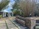 Beautifully landscaped backyard featuring stone steps, mature trees and a cozy event tent at 7237 Rum Bay Dr # 5022, Placida, FL 33946