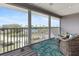 Screened balcony with beautiful outdoor view of lush greenery and a glimpse of the water at 7237 Rum Bay Dr # 5022, Placida, FL 33946