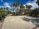 Outdoor basketball court surrounded by palm trees and greenery, offering a space for recreation at 7237 Rum Bay Dr # 5022, Placida, FL 33946