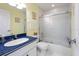 Bathroom with blue countertop, shower/tub combination, and white tiled walls at 7237 Rum Bay Dr # 5022, Placida, FL 33946