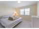 Bright bedroom with a white dresser, neutral carpet, and ample natural light at 7237 Rum Bay Dr # 5022, Placida, FL 33946