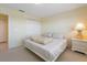 Bedroom features a large closet, neutral carpet, and side table with a decorative pineapple lamp at 7237 Rum Bay Dr # 5022, Placida, FL 33946