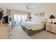 Bright bedroom with a large window leading to an outdoor patio at 7237 Rum Bay Dr # 5022, Placida, FL 33946