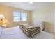Bright bedroom with a white dresser, neutral carpet, and ample natural light at 7237 Rum Bay Dr # 5022, Placida, FL 33946