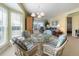 Bright dining area with a glass-top table, natural light, and inviting decor at 7237 Rum Bay Dr # 5022, Placida, FL 33946