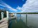 Picturesque dock featuring weathered wood and sturdy pilings reaching out to the serene water at 7237 Rum Bay Dr # 5022, Placida, FL 33946