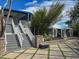 Outdoor space with a white tent, stone patio, and verdant foliage, perfect for events and relaxation at 7237 Rum Bay Dr # 5022, Placida, FL 33946