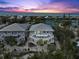 Beautiful elevated coastal home featuring spacious wraparound decks overlooking the beach at sunset at 7237 Rum Bay Dr # 5022, Placida, FL 33946