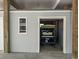 Attached garage featuring a golf cart bay with overhead protection and added window for natural light at 7237 Rum Bay Dr # 5022, Placida, FL 33946