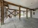 Spacious open garage features wooden support beams and lattice work with secondary golf cart bay at 7237 Rum Bay Dr # 5022, Placida, FL 33946