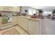 The kitchen features a dishwasher and overlooks the adjacent sitting room with a bay window at 7237 Rum Bay Dr # 5022, Placida, FL 33946