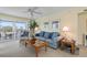 Relaxing living area with comfortable seating, natural light, and access to the outdoor balcony at 7237 Rum Bay Dr # 5022, Placida, FL 33946