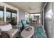Cozy screened-in porch featuring wicker furniture, a ceiling fan, and views of the outdoors at 7237 Rum Bay Dr # 5022, Placida, FL 33946
