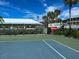 Bright tennis court with clear skies and palm trees nearby, perfect for active recreation at 7237 Rum Bay Dr # 5022, Placida, FL 33946
