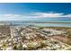 Captivating aerial view of a coastal community with waterfront homes and a house encircled in red for focus at 8159 Archie St, Englewood, FL 34224