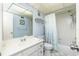 Clean bathroom featuring a vanity with a sink, a toilet, and a shower-tub combination at 8159 Archie St, Englewood, FL 34224