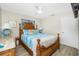 Relaxing bedroom features wood furniture, nautical themed bedding, and a ceiling fan at 8159 Archie St, Englewood, FL 34224