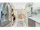 Modern kitchen equipped with stainless steel appliances, granite countertops, and ample cabinet space at 8159 Archie St, Englewood, FL 34224