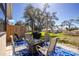 Outdoor patio includes four chairs and a built-in fire pit area at 8159 Archie St, Englewood, FL 34224