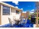 This outdoor patio offers a cozy seating area and grill for entertaining at 8159 Archie St, Englewood, FL 34224