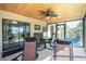 Enjoy the comfort of this outdoor living space with a ceiling fan and lounge chairs at 8159 Archie St, Englewood, FL 34224