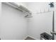 Empty walk-in closet with shelves and hangers, providing ample storage space at 8159 Archie St, Englewood, FL 34224