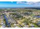 Scenic aerial view highlighting a neighborhood with canal access, lush foliage, and waterfront residences at 840 E 7Th St, Englewood, FL 34223