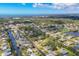 Scenic aerial view of a residential neighborhood with waterfront access and lush landscaping at 840 E 7Th St, Englewood, FL 34223