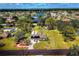 Expansive property featuring a charming home, lush landscaping, and neighborhood pond views at 840 E 7Th St, Englewood, FL 34223