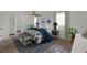 Comfortable bedroom with a plush bed, ceiling fan, and soothing decor at 840 E 7Th St, Englewood, FL 34223
