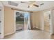 Bedroom featuring a ceiling fan and a sliding glass door that accesses the backyard at 840 E 7Th St, Englewood, FL 34223